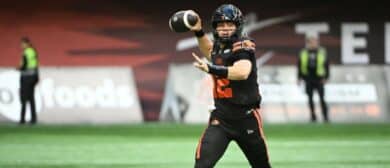 BC Lions quarterback Nathan Rourke (12) looks to pass during the first half against the Edmonton Elks at BC Place Stadium.