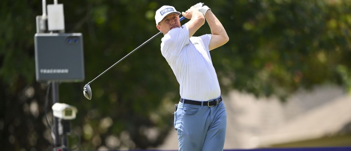 Mackenzie Hughes plays his shot from the 18th tee during the final round of the FedEx St. Jude Championship golf.