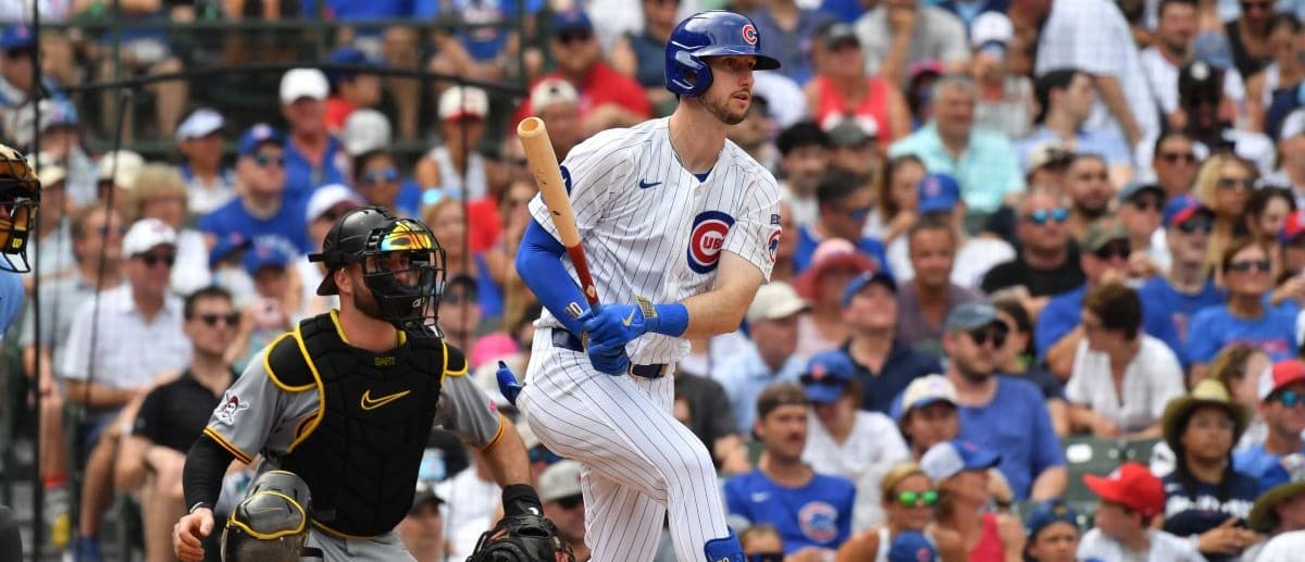 Chicago Cubs right fielder Kyle Tucker (30) hits a single during the eighth inning against the Pittsburgh Pirates at Wrigley Field