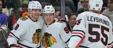 Chicago Blackhawks forward Ryan Donato (8) celebrates his goal against the Minnesota Wild with forward Connor Bedard (98) and defensemen Artyom Levshunov (55) during the third period at Xcel Energy Center