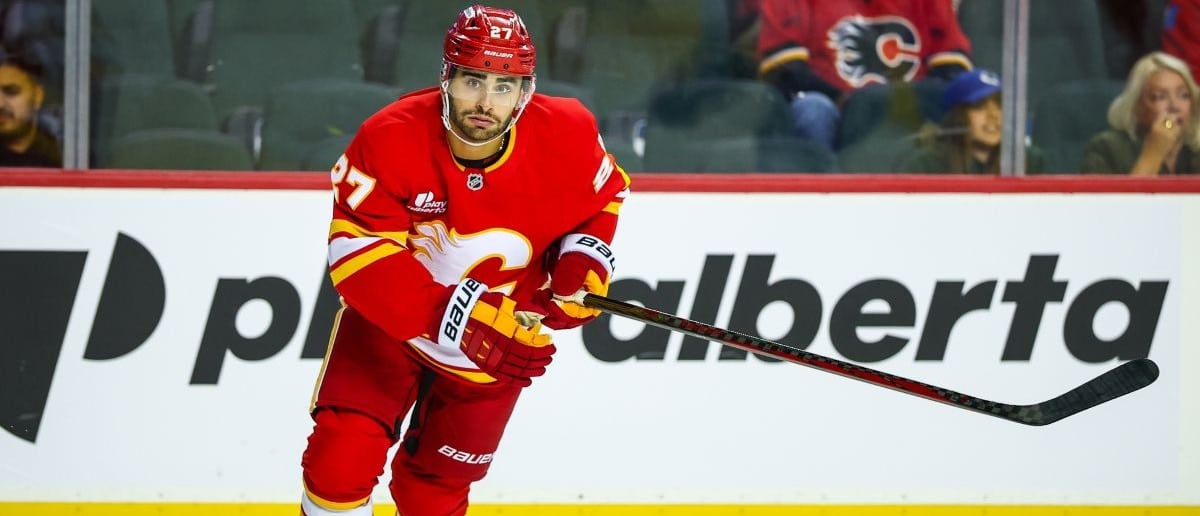 Calgary Flames right wing Matt Coronato (27) skates against the Vancouver Canucks during the first period at Scotiabank Saddledome