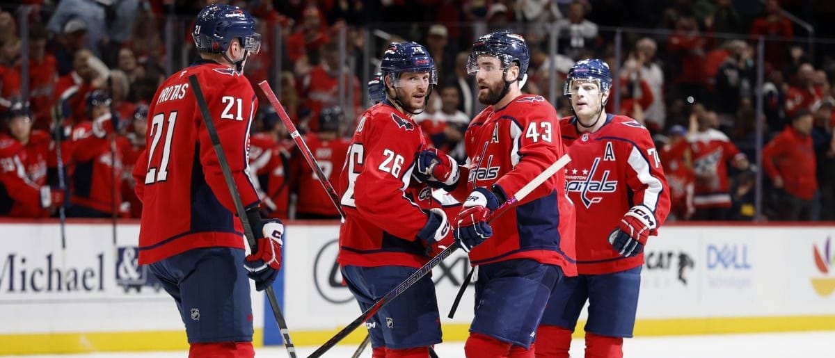 Washington Capitals right wing Tom Wilson (43) celebrates with teammates after scoring an empty net goal against the Seattle Kraken at Capital One Arena