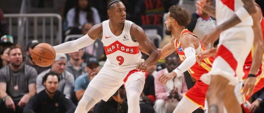 Toronto Raptors forward RJ Barrett (9) is defended by Atlanta Hawks guard Trae Young (11) in the first quarter at State Farm Arena
