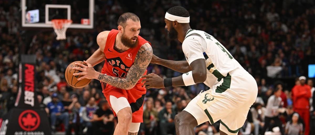 Toronto Raptors forward Sandro Mamukelashvili (54) dribbles against Milwaukee Bucks forward Bobby Portis (9) in the fourth quarter at Scotiabank Arena