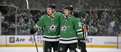 Dallas Stars center Roope Hintz (24) and left wing Jason Robertson (21) celebrates a goal scored by Robertson during the game between the Stars and the Kings at the American Airlines Center