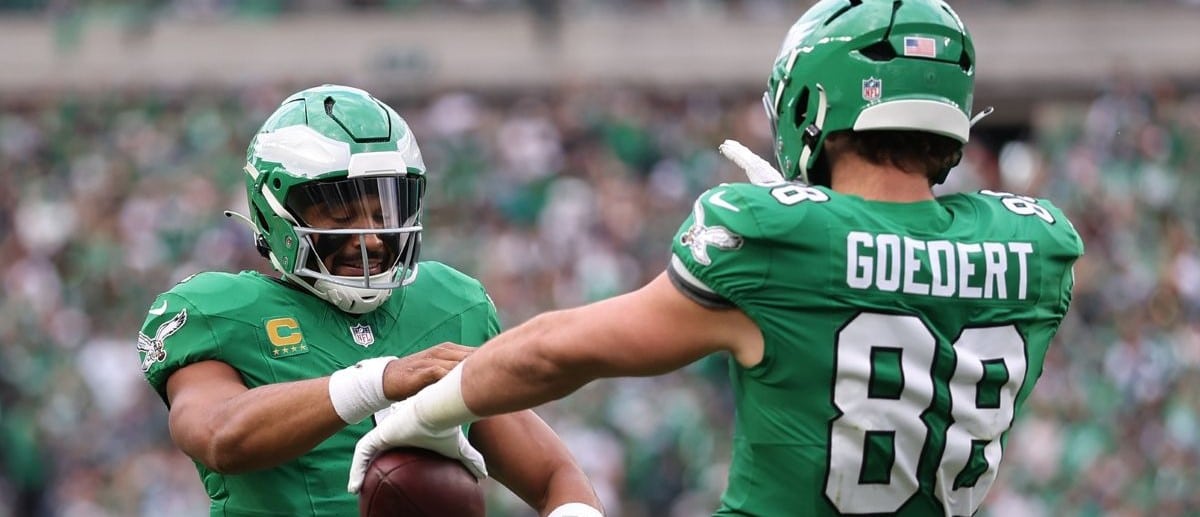 Philadelphia Eagles tight end Dallas Goedert (88) celebrates with quarterback Jalen Hurts (1) after scoring a touchdown against the New York Giants in the fourth quarter at Lincoln Financial Field