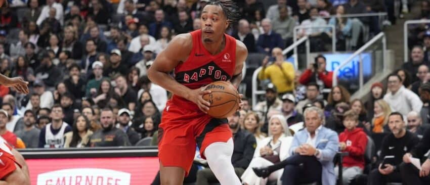 Toronto Raptors guard Scottie Barnes (4) looks to pass the ball against the Houston Rockets during the first half at Scotiabank Arena