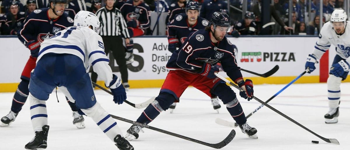 Columbus Blue Jackets center Adam Fantilli (19) carries the puck as Toronto Maple Leafs defenseman Philippe Myers (51) defnds during the second period at Nationwide Arena.