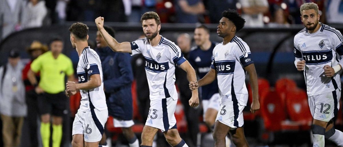 The Vancouver Whitecaps team celebrates after defeating FC Dallas in penalty kicks at Toyota Stadium.