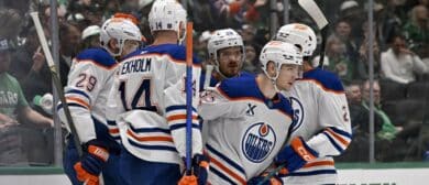 Edmonton Oilers center Leon Draisaitl (29) and defenseman Mattias Ekholm (14) and center Jack Roslovic (28) and right wing Vasily Podkolzin (92) celebrates a goal scored by Podkolzin against the Dallas Stars during the first period at the American Airlines Center.