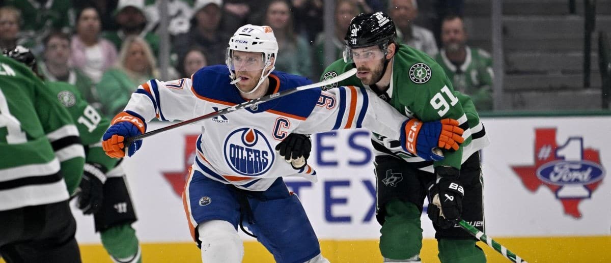 Edmonton Oilers center Connor McDavid (97) and Dallas Stars center Tyler Seguin (91) chase the puck during the third period at the American Airlines Center.