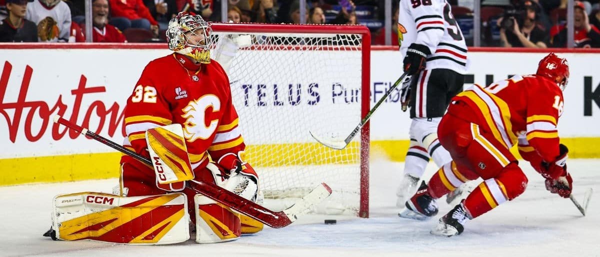 Chicago Blackhawks center Connor Bedard (98) scores a goal against Calgary Flames goaltender Dustin Wolf (32) during the third period at Scotiabank Saddledome
