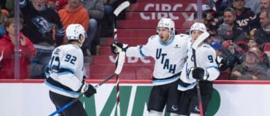 Utah Mammoth defenseman Nate Schmidt (88) celebrates with center Logan Cooley (92) and right wing Clayton Keller (9) his goal scored in the second period against the Ottawa Senators at the Canadian Tire Centre.