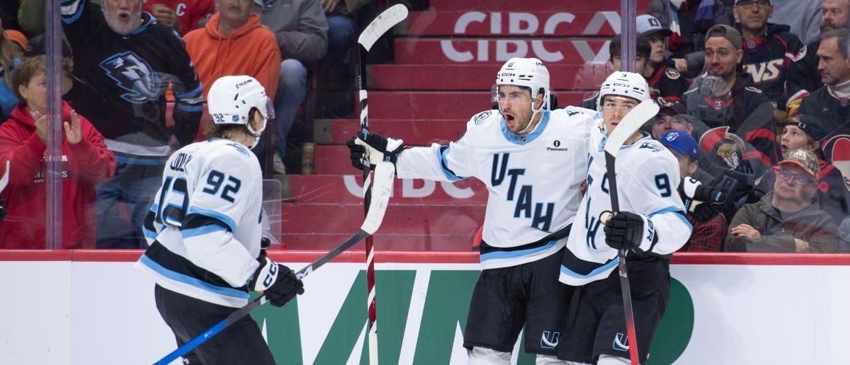 Utah Mammoth defenseman Nate Schmidt (88) celebrates with center Logan Cooley (92) and right wing Clayton Keller (9) his goal scored in the second period against the Ottawa Senators at the Canadian Tire Centre.