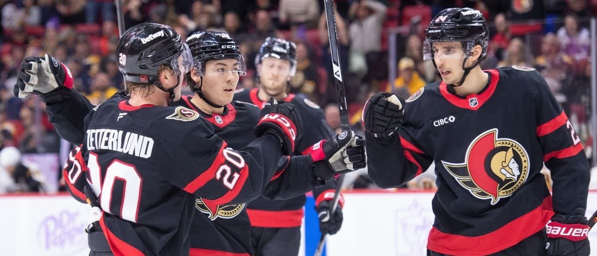 Ottawa Senators center Dylan Cozens (24) celebrates with left wing Fabian Zetterlund (20) and defenseman Jordan Spence (10) after scoring in the first period against the Boston Bruins at the Canadian Tire Centre