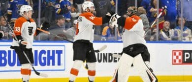 Philadelphia Flyers center Sean Couturier (14) celebrates with goaltender Samuel Ersson (33) after the Flyers defeated the St. Louis Blues in shootouts at Enterprise Center