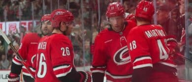 Carolina Hurricanes center Jordan Staal (11) celebrates his goal with left wing Jordan Martinook (48) defenseman Sean Walker (26) and left wing William Carrier (28) against the Edmonton Oilers during the third period at Lenovo Center