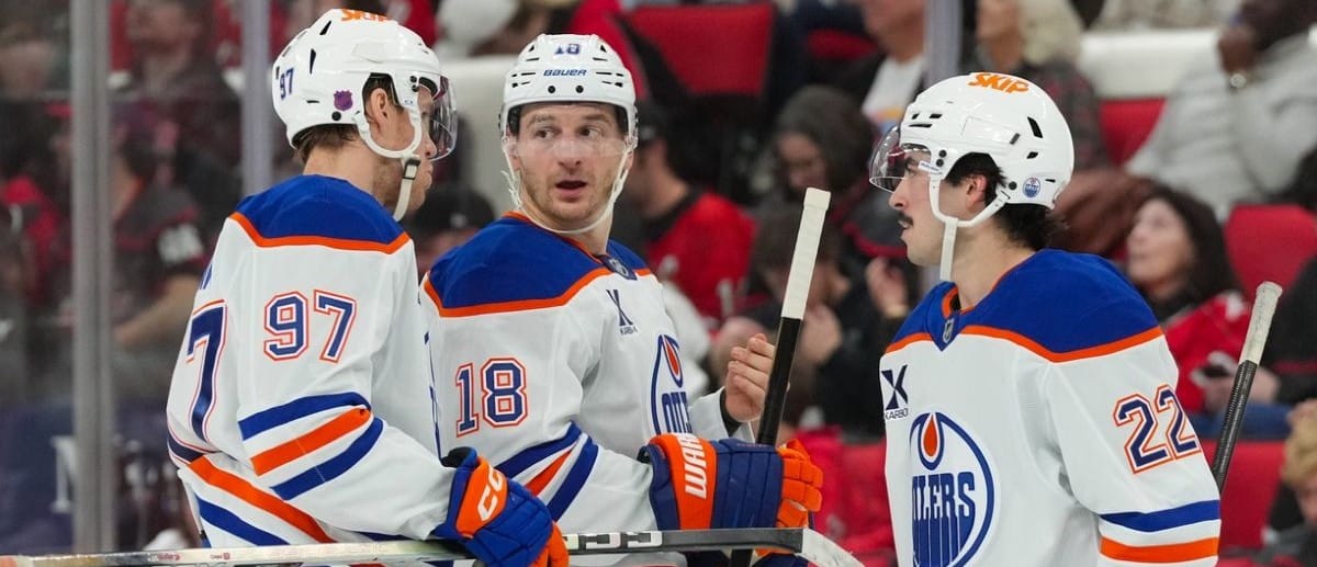 Edmonton Oilers center Connor McDavid (97) left wing Zach Hyman (18) and center Matt Savoie (22) talk Carolina Hurricanes during the second period at Lenovo Center.