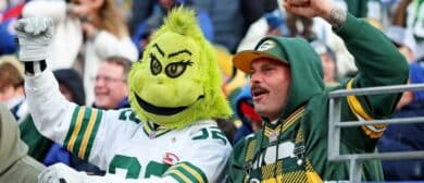Green Bay Packers fans cheer during the game between the New York Giants and the Green Bay Packers at MetLife Stadium.