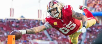San Francisco 49ers tight end George Kittle (85) scores a touchdown during the fourth quarter against the Los Angeles Rams at Levi's Stadium