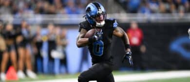 Detroit Lions running back Jahmyr Gibbs (0) runs with the ball for a touchdown during the fourth quarter against the New York Giants at Ford Field