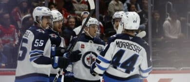 Winnipeg Jets center Gabriel Vilardi (13) celebrates with teammates after scoring a goal against the Washington Capitals during the second period at Capital One Arena.