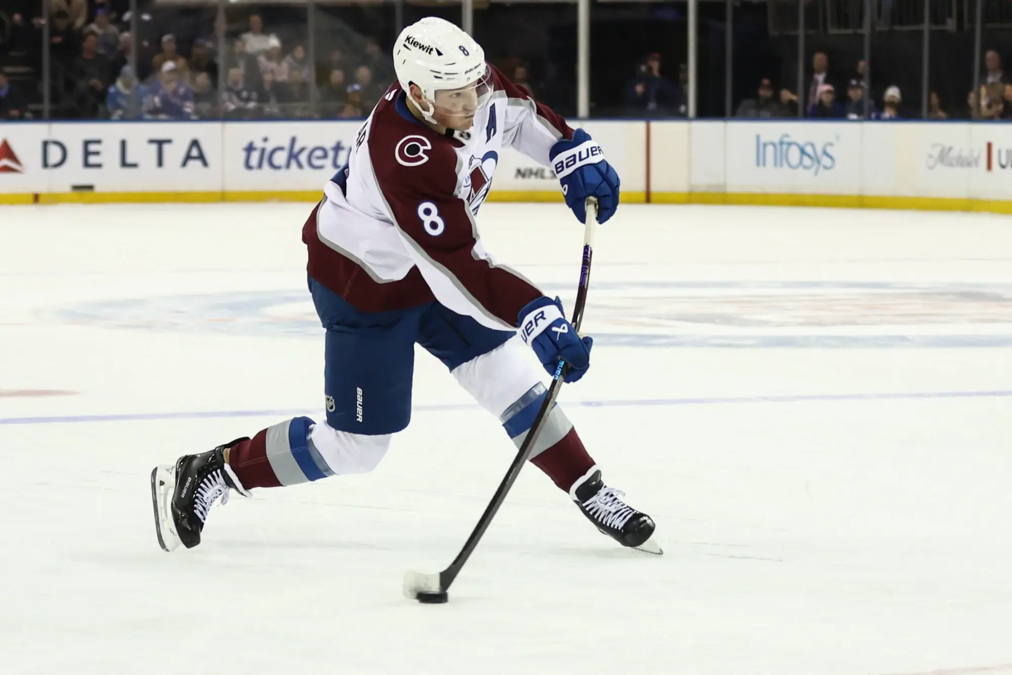 Dec 6, 2025; New York, New York, USA; Colorado Avalanche defenseman Cale Makar (8) attempts a shot on goal in the first period against the New York Rangers at Madison Square Garden.