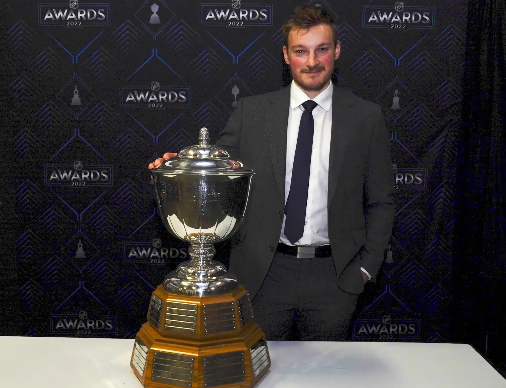 Colorado Avalanche's Cale Makar poses with the Norris Trophy after the NHL hockey awards Tuesday, June 21, 2022, in Tampa, Fla.