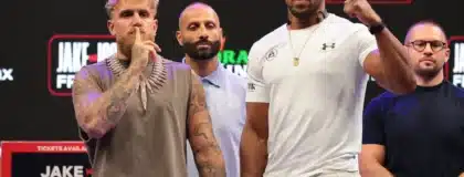 Nov 21, 2025; Miami, Florida, UNITED STATES; Jake Paul and Anthony Joshua face off after a press conference announcing their heavyweight boxing match at Kayesa Center.