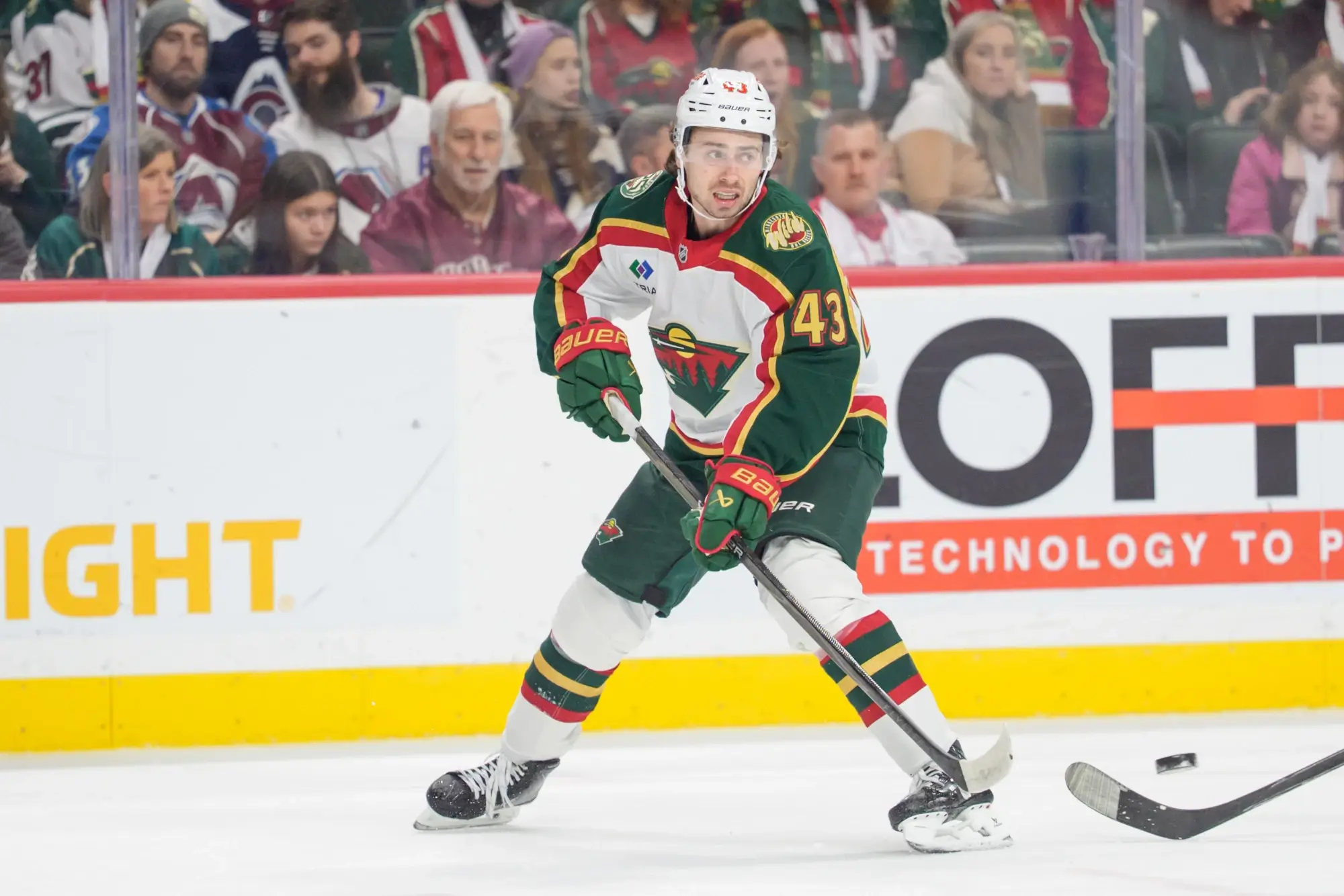 Dec 21, 2025; Saint Paul, Minnesota, USA; Minnesota Wild defenseman Quinn Hughes (43) clears the puck in the first period against the Colorado Avalanche at Grand Casino Arena.