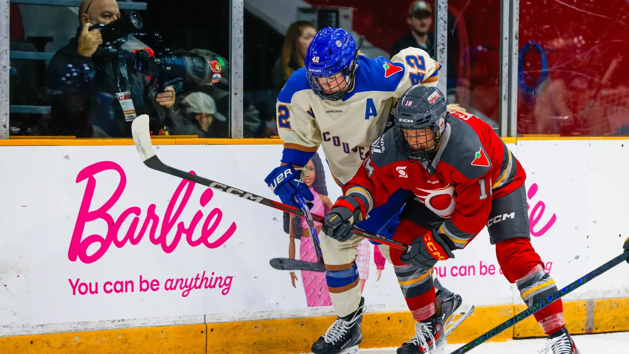 The Vancouver Goldeneyes battle with the Ottawa Charge in a PWHL game in December 2025.
