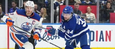 Toronto Maple Leafs center Auston Matthews (34) battles with Edmonton Oilers center Connor McDavid (97) during the first period at Scotiabank Arena