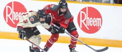 Montreal forward Tereza Vanisova (21) battles with Ottawa forward Emily Clark (26) in the third period in a PWHL hockey game at TD Place.
