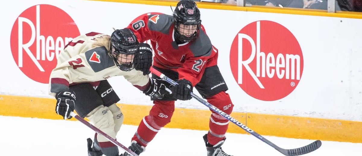 Montreal forward Tereza Vanisova (21) battles with Ottawa forward Emily Clark (26) in the third period in a PWHL hockey game at TD Place.