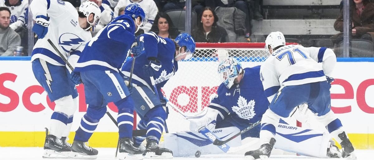 Toronto Maple Leafs goaltender Joseph Woll (60) stops the puck as Tampa Bay Lightning center Anthony Cirelli (71) looks for the rebound during the third period at Scotiabank Arena.