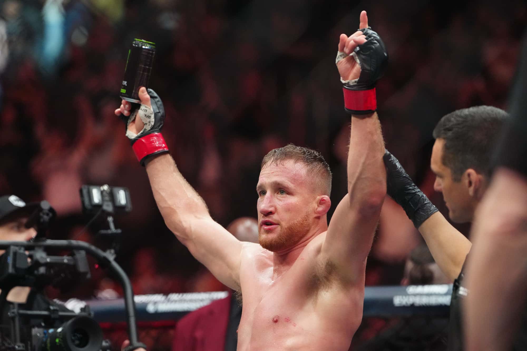 Justin Gaethje getting his hand raised after defeating Rafael Fiziev.