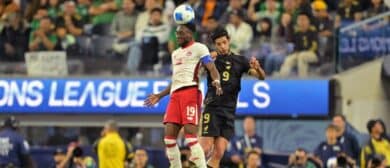 Canada defender Alphonso Davies (19) battles for a header against Mexico forward Raul Jimenez (9) during the first half of a Concacaf Nations League semifinal match at SoFi Stadium
