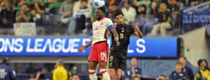 Canada defender Alphonso Davies (19) battles for a header against Mexico forward Raul Jimenez (9) during the first half of a Concacaf Nations League semifinal match at SoFi Stadium