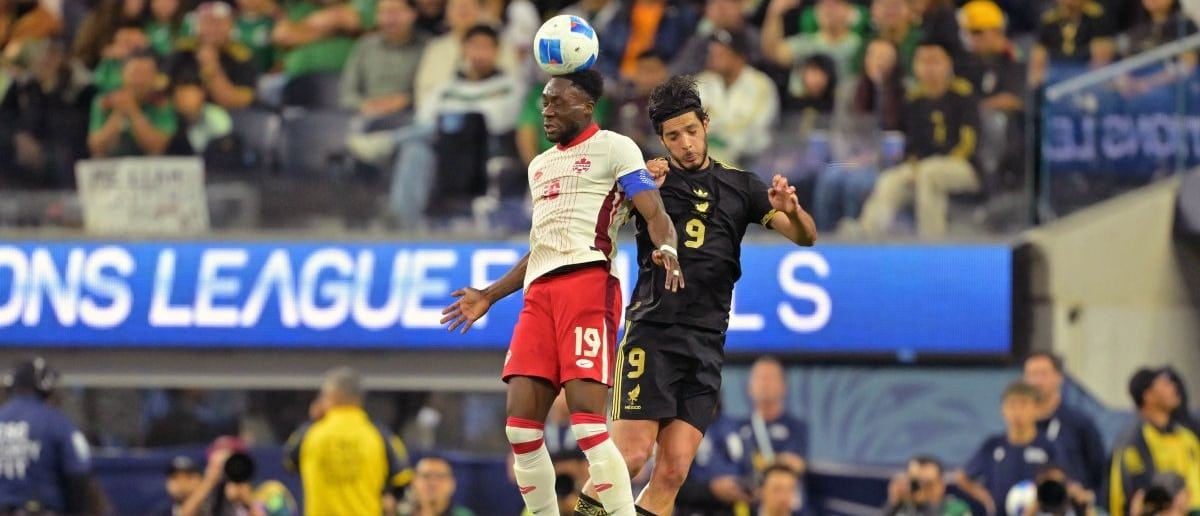 Canada defender Alphonso Davies (19) battles for a header against Mexico forward Raul Jimenez (9) during the first half of a Concacaf Nations League semifinal match at SoFi Stadium