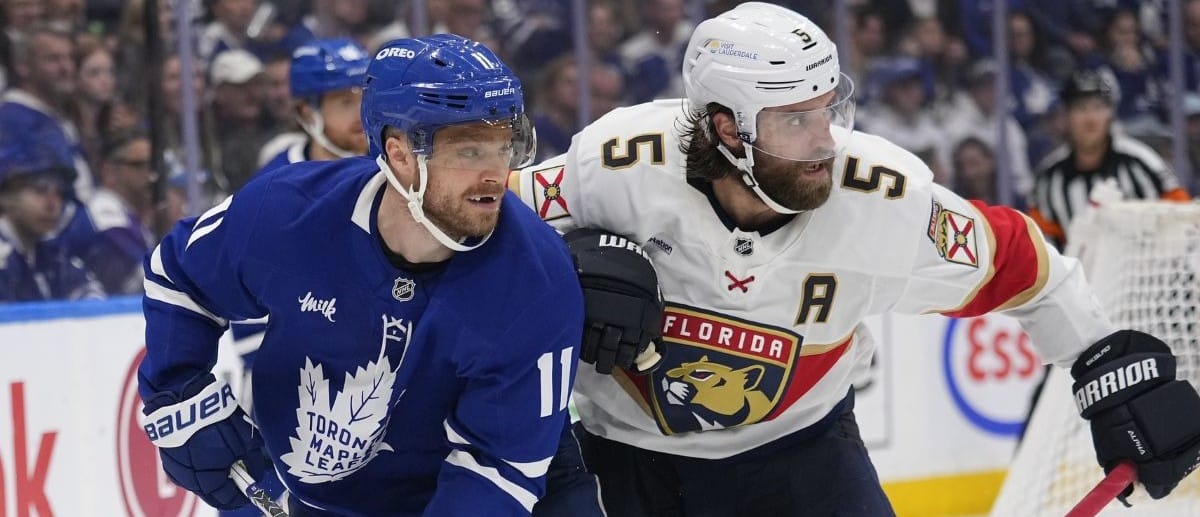 Toronto Maple Leafs forward Max Domi (11) and Florida Panthers defenseman Aaron Ekblad (5) battle for position during the third period of game seven of the second round of the 2025 Stanley Cup Playoffs at Scotiabank Arena