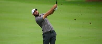Scottie Scheffler takes a shot on the tenth hole during the second round of the TOUR Championship golf tournament.
