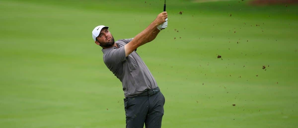 Scottie Scheffler takes a shot on the tenth hole during the second round of the TOUR Championship golf tournament.