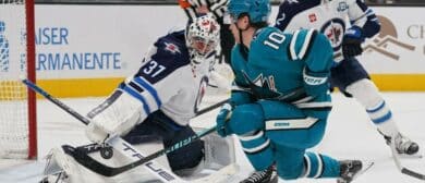 Winnipeg Jets goalie Connor Hellebuyck (37) makes a save and defenseman Dylan DeMelo (2) watches the play against San Jose Sharks center Ty Dellandrea (10) during the second period at SAP Center at San Jose.