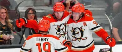 Anaheim Ducks defenseman Jacob Trouba (65) celebrates with center Leo Carlsson (91) and right wing Troy Terry (19) after scoring a goal against the Vegas Golden Knights during an overtime period to give the Ducks a 4-3 victory at T-Mobile Arena.