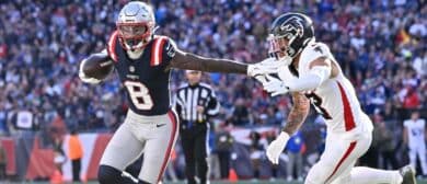 New England Patriots wide receiver Stefon Diggs (8) stiff arms Atlanta Falcons safety Jessie Bates III (3) during the first half at Gillette Stadium.