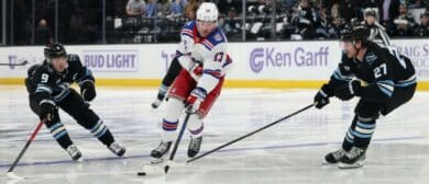 New York Rangers left wing Alexis Lafreniere (13) skates against Utah Mammoth right wing Clayton Keller (9) and center Barrett Hayton (27) during the second period at Delta Center