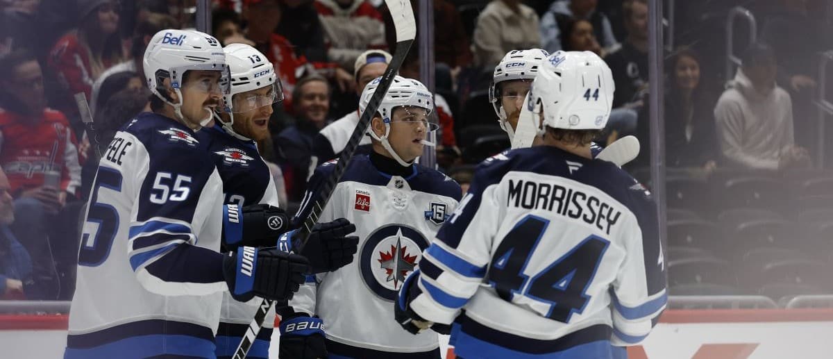 Winnipeg Jets center Gabriel Vilardi (13) celebrates scoring against the Carolina Hurricanes with center Mark Scheifele (55) in the first period at Canada Life Centre.