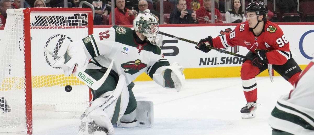 Chicago Blackhawks center Connor Bedard (98) scores a goal on Minnesota Wild goaltender Filip Gustavsson (32) during the second period at United Center.