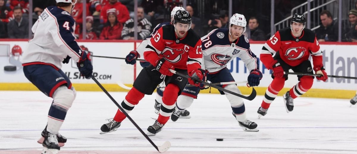 New Jersey Devils center Nico Hischier (13) skates with the puck against the Columbus Blue Jackets during the second period at Prudential Center.