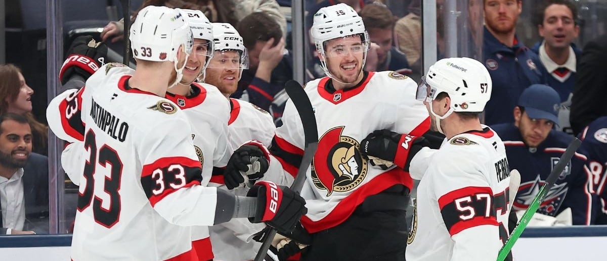 Ottawa Senators right wing Drake Batherson (center) celebrates his goal with left wing David Perron (57) and defenseman Nikolas Matinpalo (33) during the first period against the Columbus Blue Jackets at Nationwide Arena